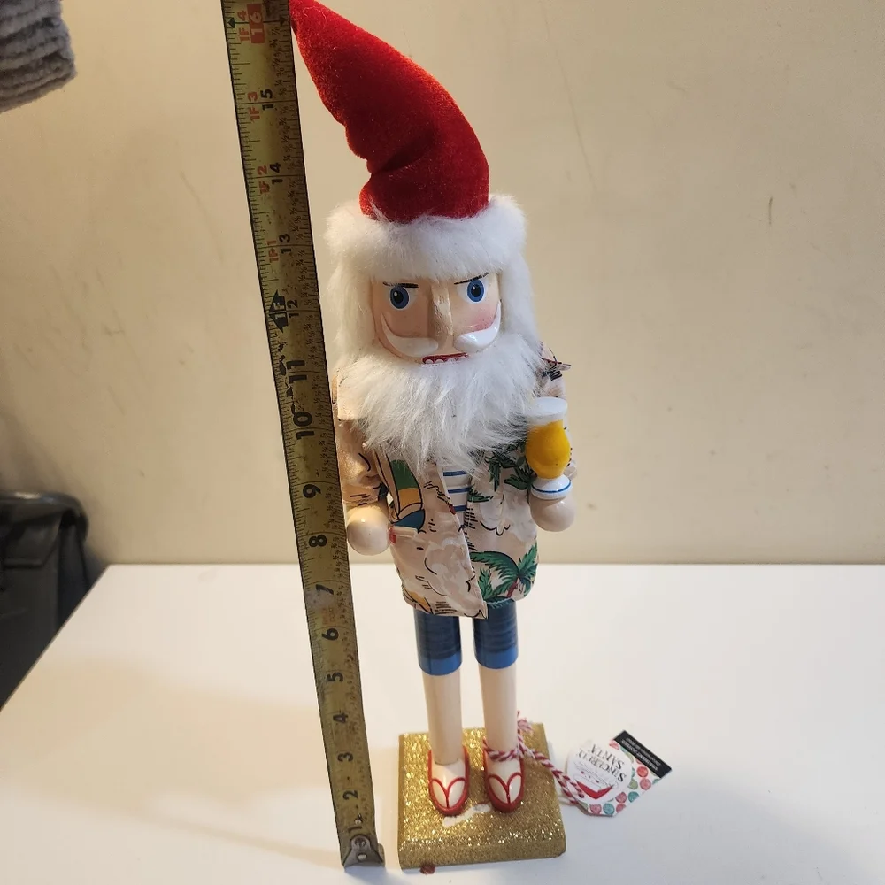 Wooden nutcracker styled as a Beachy  Santa Claus W/floral shirt, sunglasses